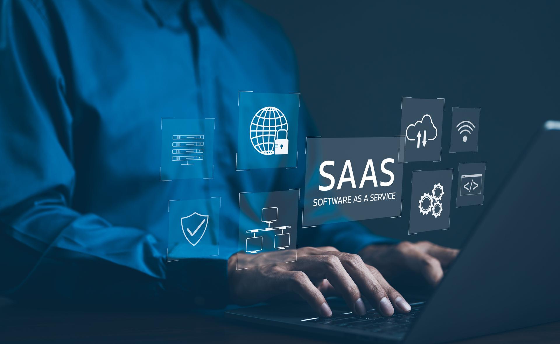 SaaS Concept, Software as a Service, A man types on laptop with digital icons representing various aspects of Software as a Service (SaaS), emphasizing modern technology platforms and cloud computing.