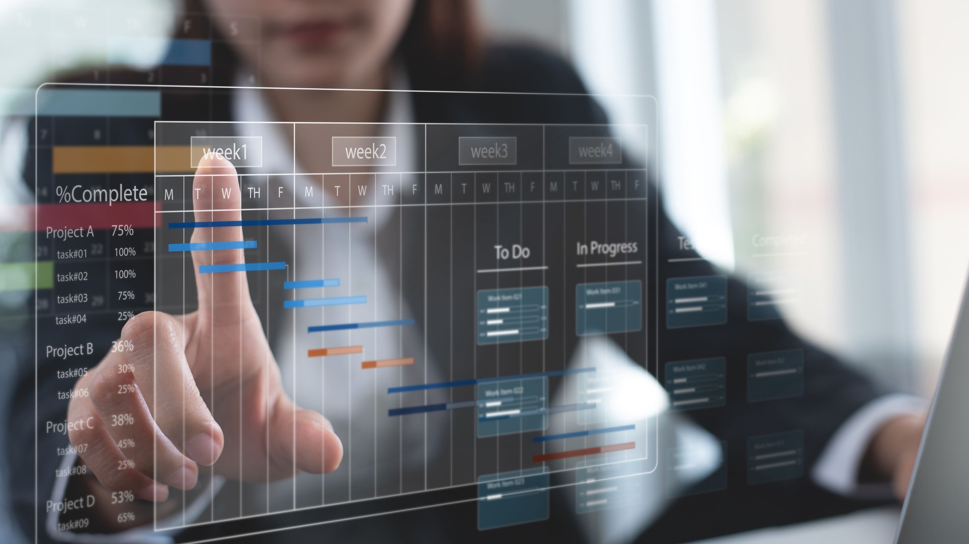Business Project Management System. Project manager working on laptop and updating tasks and milestones progress planning with Gantt chart scheduling interface for company on virtual screen.